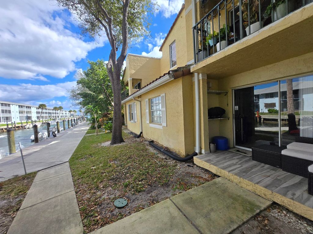 Photo of 1105 Lake Shore Drive #102, Lake Park, FL 33403 (MLS # R11156178)