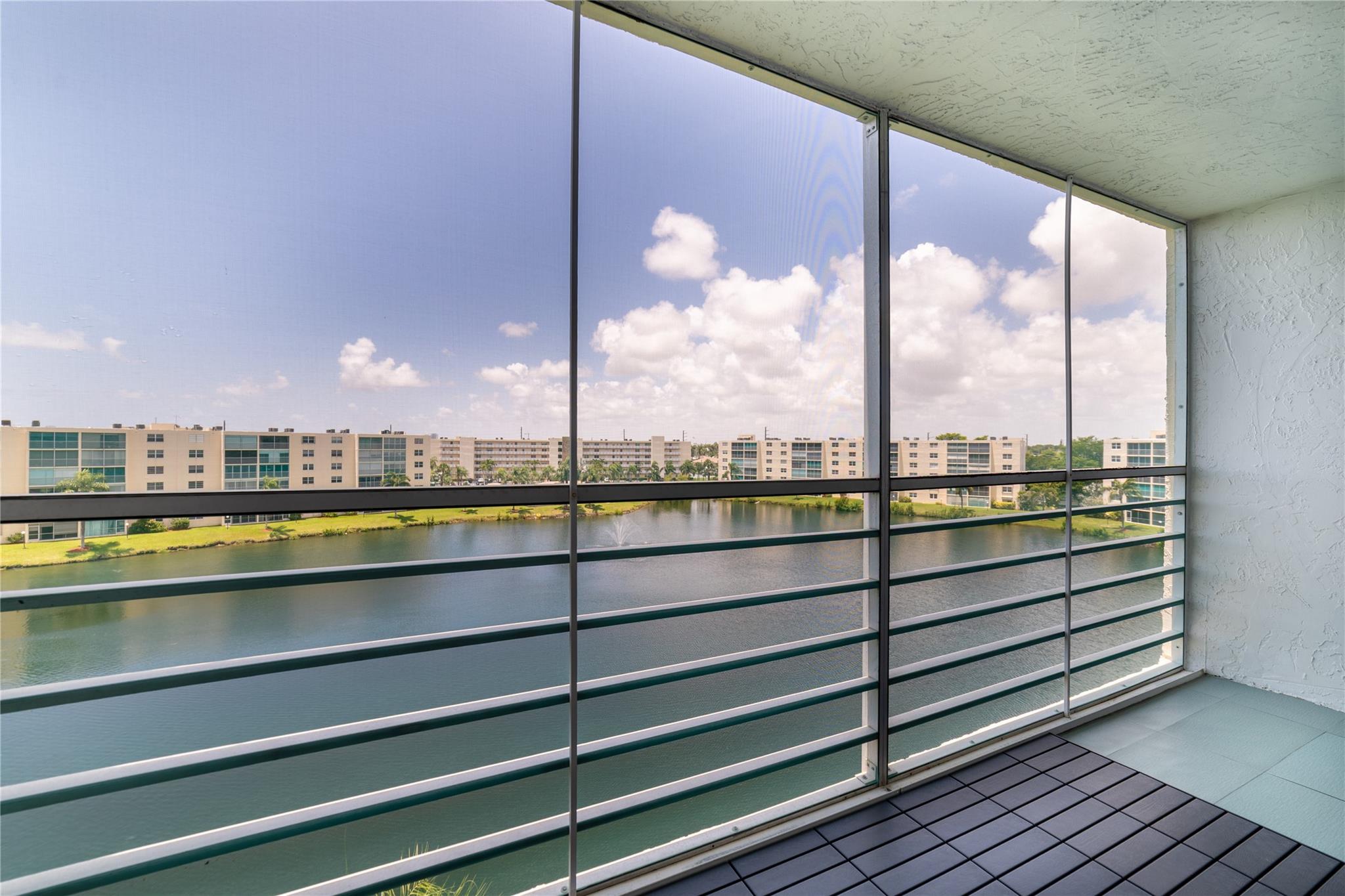 Welcome to this beautifully maintained 2 bedroom, 2 bathroom condo in the highly sought-after Meadowbrook Lakes community in Dania Beach! With 1,190 sq ft. of open concept living space, this freshly painted unit offers a bright and airy layout with serene lake views from the private screened in balcony -- perfect for relaxing or entertaining. The condo features waterproof vinyl flooring on the balcony, ample closet space, and recent upgrades including a new AC and handler, new water heater, and new garbage disposal. Enjoy peace of mind with no upcoming assessments, reserves in place, a completed 40-year inspection, a new roof and a renovated elevator in the building. You're minutes from shopping, dining, and beaches! This condo checks all the boxes!