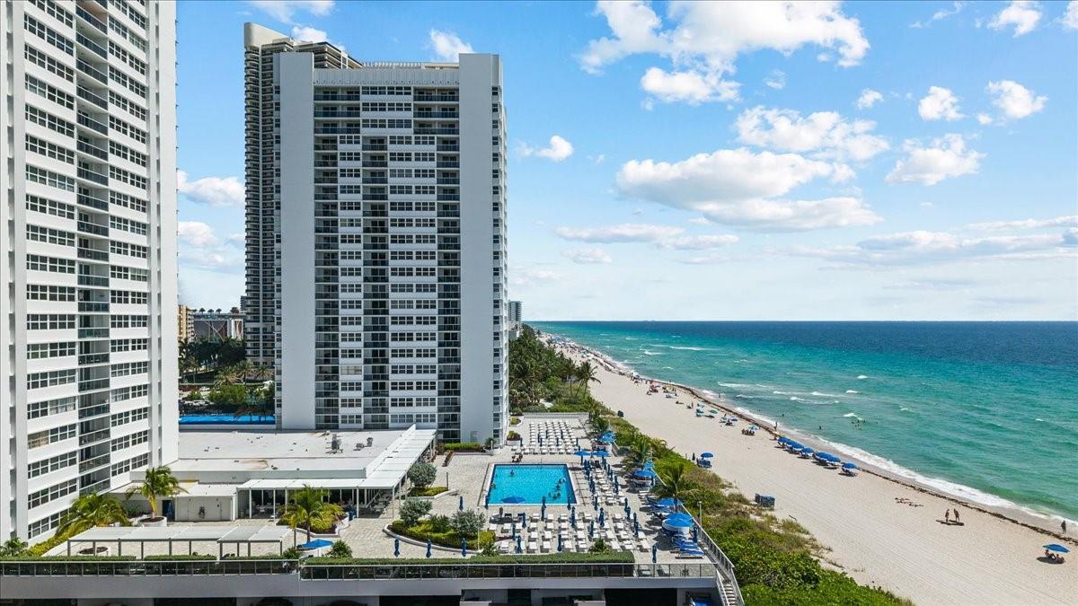 Step into beachfront luxury in this expansive 3 bedroom 3 bathroom penthouse with bonus office/storage room in the best line at La Mer. Wake up to the sunrise over the ocean and unwind with sunset views over the Intracoastal, all from your private balcony. This light-filled residence offers two spacious primary suites with en-suite baths, a third bedroom with adjacent full bath, generous living space, custom-designed kitchen, impact windows perfect for soaking in the views. Feel the sand beneath your feet just steps from your door. La Mer offers resort-style amenities including oceanfront pool, private beach access, restaurant, tennis, valet, fitness center, garage parking, and 24hr security. Live like you're on vacation every day in this rarely available, top-floor coastal retreat.