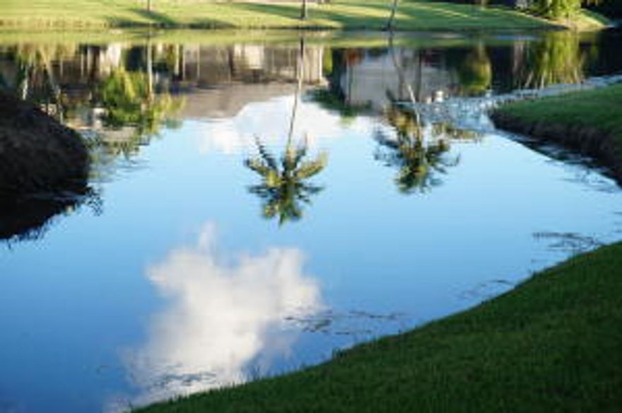 LOCATION,LOCATION,LOCATION!!! THE ABSOLUTE BEST LOT IN BOCA RIDGE, PERIOD!!! ONE OF THE MOST BEAUTIFUL VIEWS YOU WILL EVER SEE! SERENITY AWAITS YOU WITH A LONG VIEW OF THE LAKE AND STUNNING LANDSCAPING, SEEN FROM LIVING AND DINING ROOM & FROM THE TREMENDOUS TILED SCREEN ROOM & PATIO.  STUNNING LAKEFRONT 3 BED 2.5 BATH TOWNHOME W/GARAGE. EXTRA WIDE DRIVEWAY ACCOMODATES 2-3 CARS. CONVENIENCE GALORE! LOCATED RIGHT ACROSS FROM COMM POOL/TENNIS/MAILBOX!  1ST FLOOR HAS NEWER LAMINATE WOODEN FLOORING & TILE THROUGHOUT.  EAT-IN-KITCHEN HAS PANTRY W/PULL-OUT DRAWERS AND CORIAN COUNTERTOPS. 1ST FLR LARGE MASTER SUITE HAS HERS(WALK-IN) & HIS CLOSETS, MASTER BATH W/ROMAN TUB & SEPARATE WALK-IN SHOWER. 2ND FLOOR HAS 2 BEDROOMS W/JACK & JILL BATH.NEWER A/C, WASHER & DRYER. HURRICANE ACCORDIAN SHUTTERS!