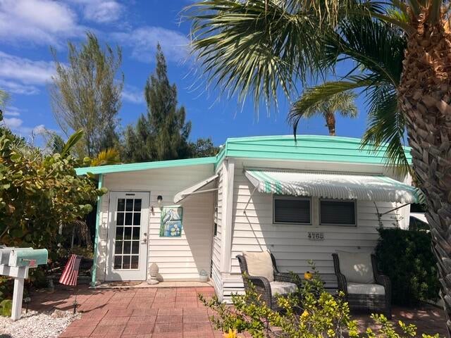 Photo of 4768 NE BLUE HERON Lane, Jensen Beach, FL 34957 (MLS # B26092163)