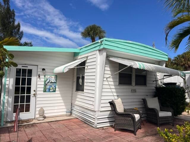 Photo of 4768 NE BLUE HERON Lane, Jensen Beach, FL 34957 (MLS # B26092163)