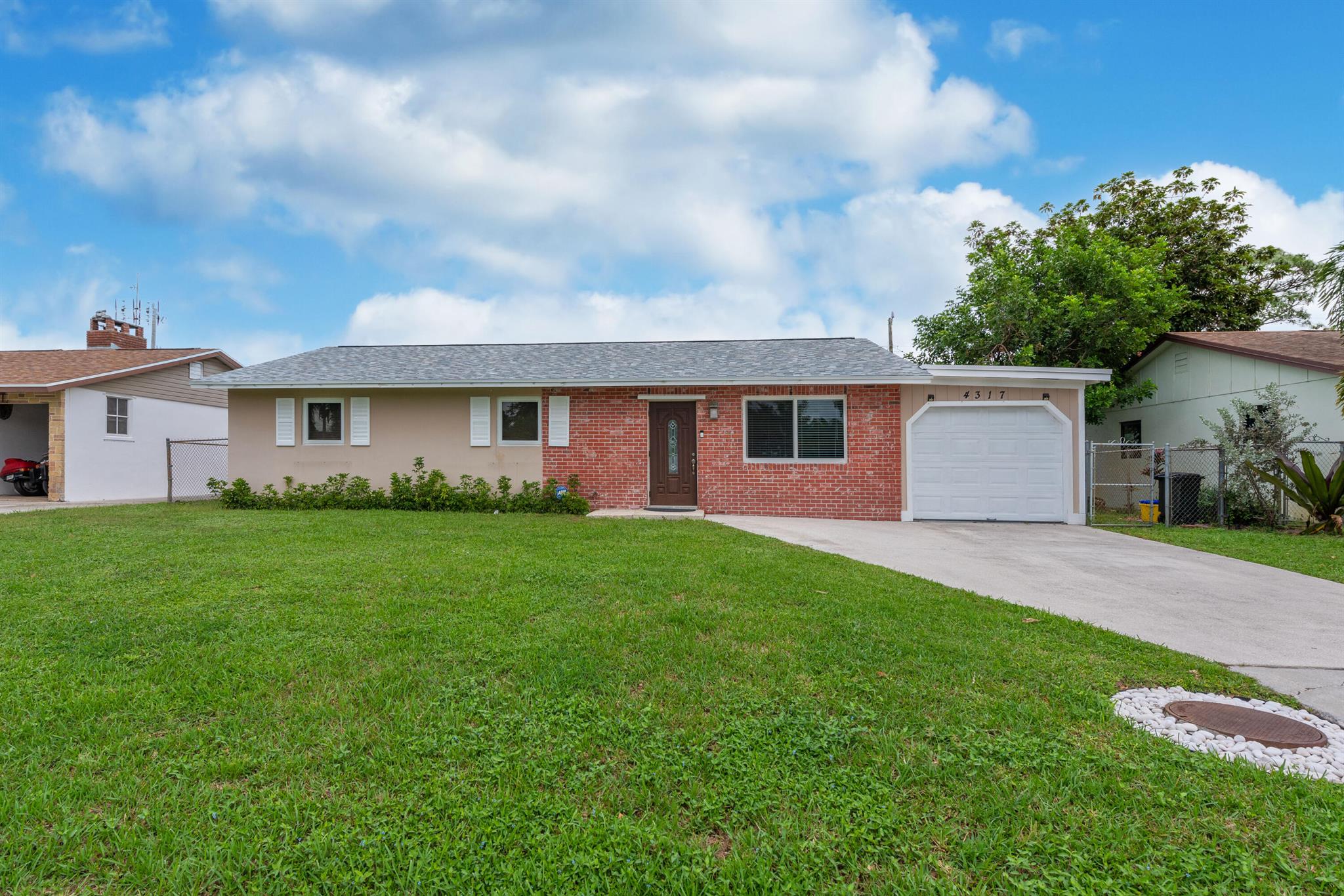 Beautifully remodeled 3-bedroom, 2-bath home with a 1-car garage in highly sought-after Palm Beach Gardens. Ideally located near premier shopping and dining destinations. The updated kitchen features granite countertops, a floating island, and upgraded appliances. Enjoy the convenience of a spacious, air-conditioned laundry room with full-size washer and dryer. Step outside to a large screened-in porch and a fully fenced backyard--perfect for relaxing or entertaining. Don't miss this opportunity--call today to schedule your private tour!
