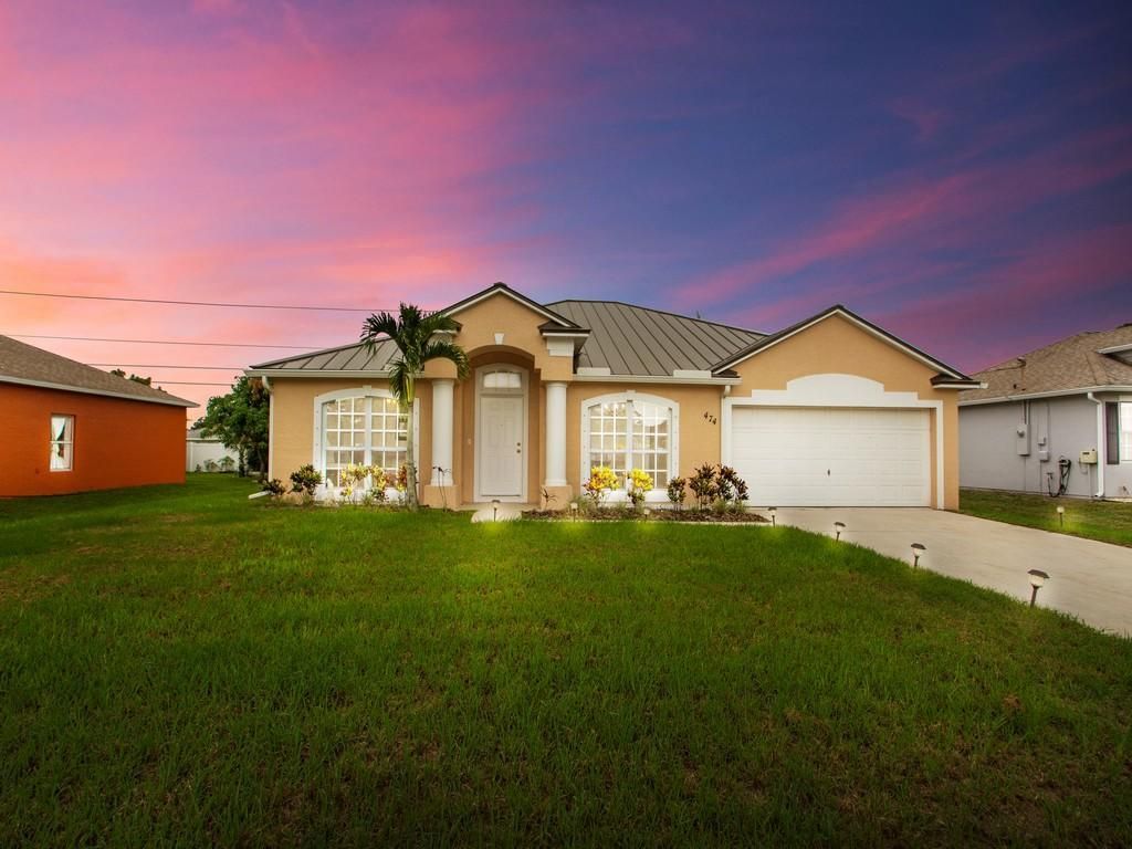 Photo of 474 SW Laconic Avenue, Port Saint Lucie, FL 34953 (MLS # R10727924)
