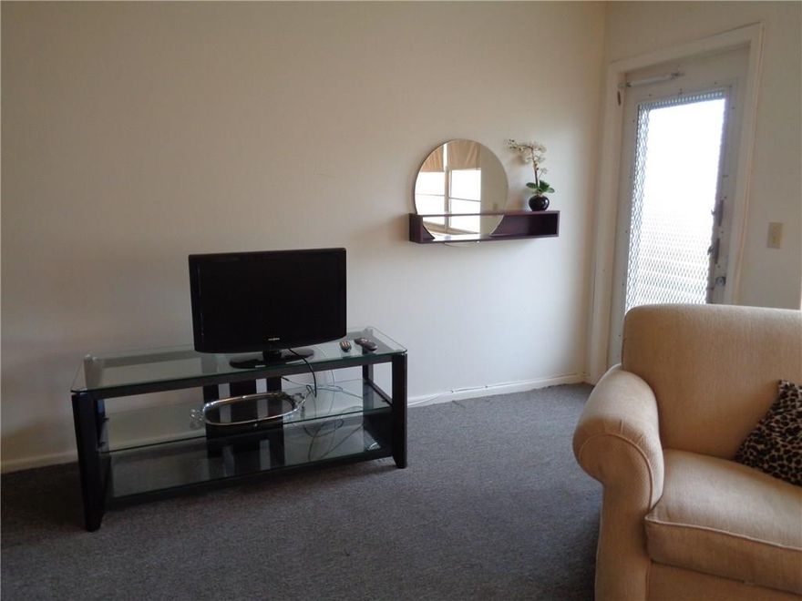 Lovely first floor unit on the water, 2 air conditioners, carpeted unit.  Under carpet is beautiful tile. New kitchen, new refrigerator. Enclosed sun room part of bedroom.