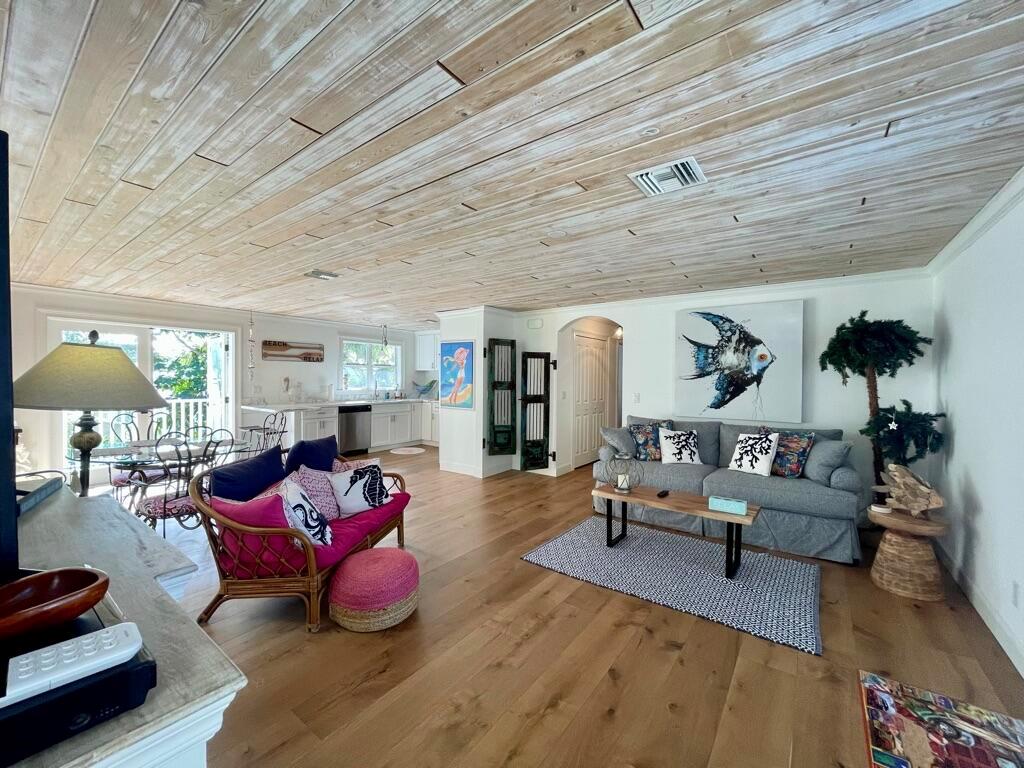 Beautiful Relaxing Beach Getaway. Newly Updated Contemporary Oasis. This private 2 Bedroom 2 Bath cottage just steps to the wide, warm, sunny beaches. Fully furnished coastal design has an open floor plan with large balcony. Real wood floors, updated bathrooms and inviting kitchen with stainless appliances and marble countertop. This turnkey retreat offers a cozy, comfortable, peaceful vacation experience. Come enjoy the sun & surf in this immaculate, light & bright property. Great Condo, perfect location!