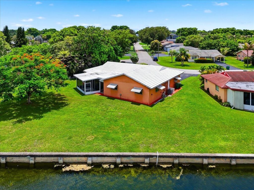 Photo of 9401 NW 70 Place, Tamarac, FL 33321 (MLS # B26052563)