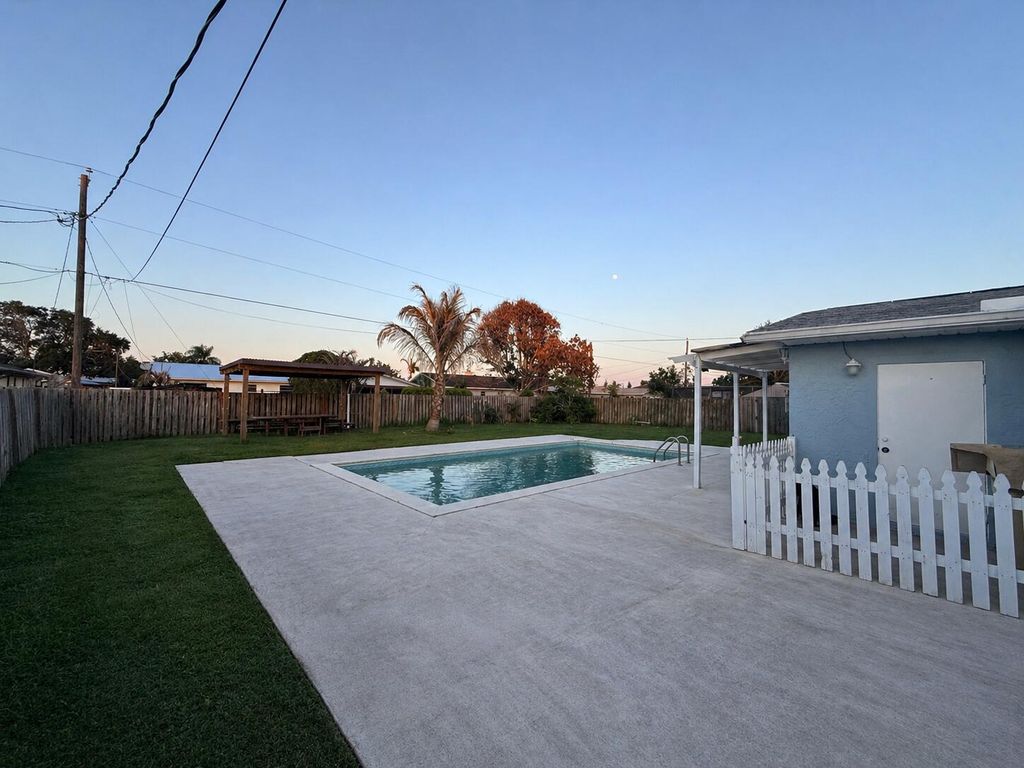 Photo of 435 SE Asbury Lane, Port Saint Lucie, FL 34983 (MLS # B26022427)