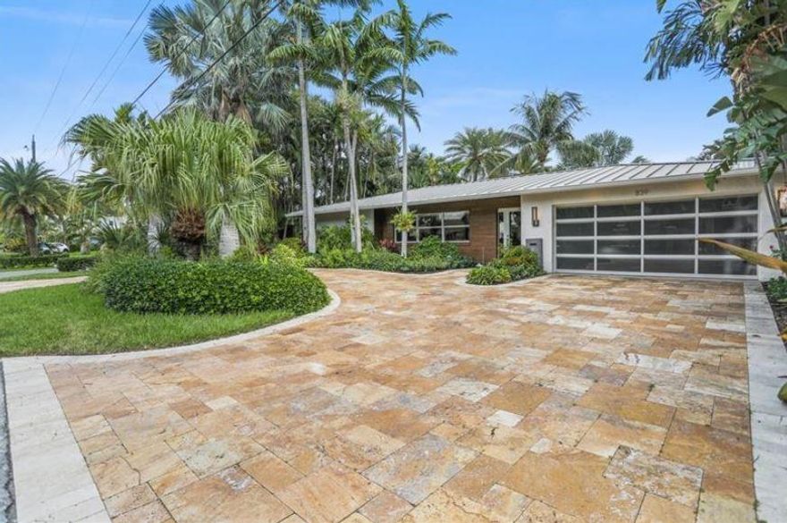 Welcome to Paradise! Completely remodeled and furnished stunning home ready to entertain! This home sits on a 90-foot-wide canal only 5 homes away from the intracoastal. This home offers a chef's gourmet kitchen with natural gas range, Bosch dishwasher, custom built refrigerator, custom cabinets, and a large quartz countertop, not to mention a natural gas generator for the entire home. This house consist of hurricane impact windows with a new metal roof installed in 2018. The Tropical oasis surrounding the pool and spa overlooks the canal with custom outdoor lighting, stone marble deck, and a mosquito control system. Park your boat on the new 85ft Boat Dock, with 16,000 lb cradle boat lift, floating jet ski dock, and covered sitting area overlooking entire backyard.