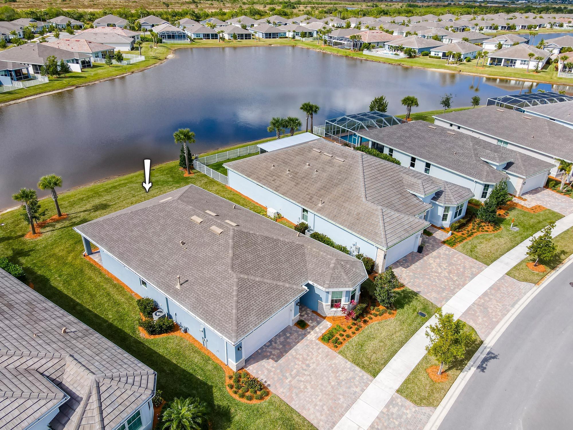 Step into this almost new meticulously maintained lakefront home in the highly sought after 55+ community of Del Webb. Prepare to be wowed once you walk in and see the gorgeous lake views from your back patio. Sip your favorite beverage as you take in the spectacular sunsets overlooking the lake. This home features CBS Construction with hurricane impact windows and doors for total peace of mind. Some of the many other features include: Light gray wood cabinets with soft close drawers, stainless appliances, granite counters, and a large farm sink in the kitchen island. The bathrooms features gray cabinets, dual sinks, granite counters, tiled shower w/ frameless shower door. Accent stone added for that elegant look. One of the Best priced waterfront homes in the community.