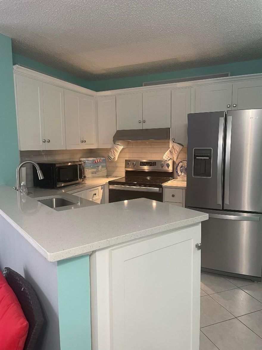 Step into easy, breezy South Florida living! Welcome home to this beautifully updated, first-floor condo in the sought-after 55+ community of Evergreen. This move-in-ready 2-bedroom, 2-bath residence features a newly renovated kitchen and comes fully furnished for effortless living. Relax and enjoy the gorgeous South Florida sunshine on your oversized lanai, and appreciate the convenience of a full-size washer and dryer right in the unit. An exterior storage closet provides even more room for your belongings. Residents also enjoy access to the stunningly remodeled Huntington Lakes clubhouseâ”offering a vibrant community lifestyle and fantastic amenities. Ideally located near West Delray's shopping and just a short drive to the fine dining of downtown Delray Beach,6 miles to the beach Basic cable, internet, and water are included. Minimum 1-year lease. No smoking. Maximum of 2 tenants. Tenant is responsible for minor maintenance. This is a 55+ community per condominium rules and regulations.