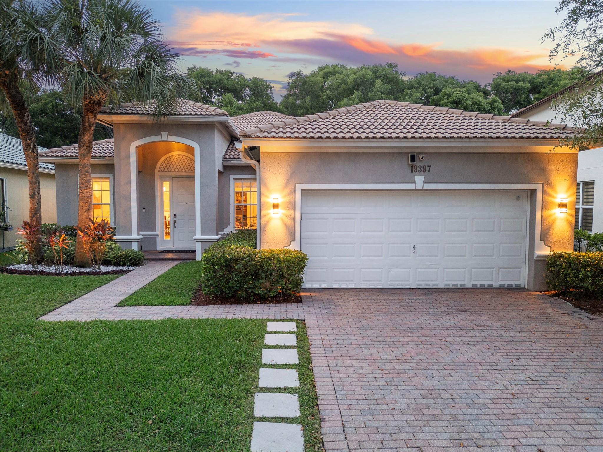 Live in one of Florida’s most desirable cities, Weston, in the prestigious gated community of Isles at Weston. This elegant one-story home features soaring 14’ ceilings, a bright open layout, and a stunning chef’s kitchen with a large island and top-tier appliances. Relax in your private backyard with a covered patio, perfect for entertaining or unwinding. Enjoy resort-style amenities including 2 pools, a modern gym, spa, clubhouse, playgrounds, and more. Walk to A+ rated schools in a safe, family-friendly community. Roof re-certified and transferable to buyers. Don’t miss this opportunity to live where comfort, luxury, and lifestyle come together.