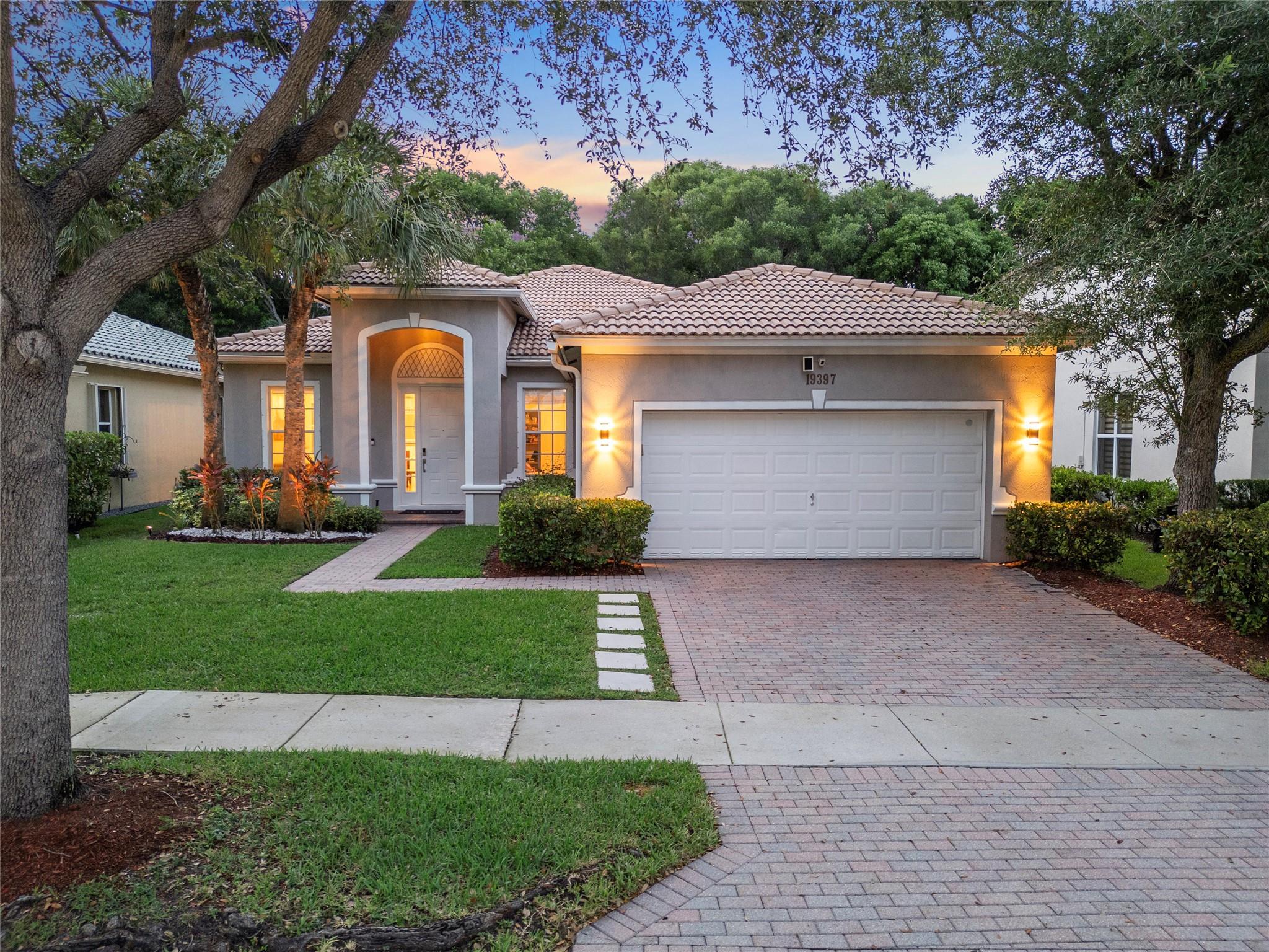 $20,000 being offered by sellers toward buyers' closing costs for contracts signed by 8/15/2025! Don't wait, incredible opportunity in this sought-after community waiting for you to call Home and create memories! Experience luxury and comfort in the heart of Weston’s prestigious gated community, Isles at Weston! This elegant one-story home features soaring 14' ceilings, a bright, open layout, and a beautifully updated chef’s kitchen with a spacious island and high-end appliances. The private backyard offers a covered patio—perfect for entertaining or quiet relaxation. Resort-style amenities include two pools, gym, spa, clubhouse, playgrounds, and more. Walk to top-rated A+ schools in a secure, family-friendly neighborhood. Roof recently re-certified with transferable documentation.