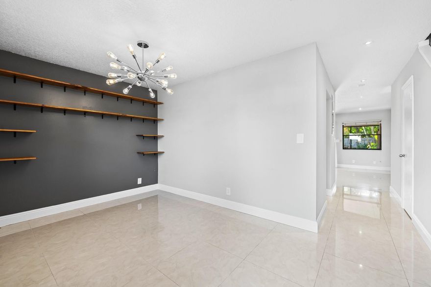 Discover the perfect blend of comfort, style, and convenience in this beautifully upgraded 2-bedroom, 2.5-bathroom fee simple townhome, just steps away from vibrant Wilton Drive. This well-appointed home boasts impact windows and doors, upgraded kitchen and bathrooms with modern finishes, and sleek tile flooring throughout. Both spacious master bedrooms offer private baths and generous closet space. Enjoy the screened-in patio, or entertain friends and family in the oversized fenced yard, offering both privacy and space for gatherings. Nestled in a well-maintained, pet-friendly community at the quiet end of the street, this home offers a large driveway accommodating up to four cars. Located just two blocks from Wilton Drive, you'll love the easy walk to dining, shopping, and entertainment.