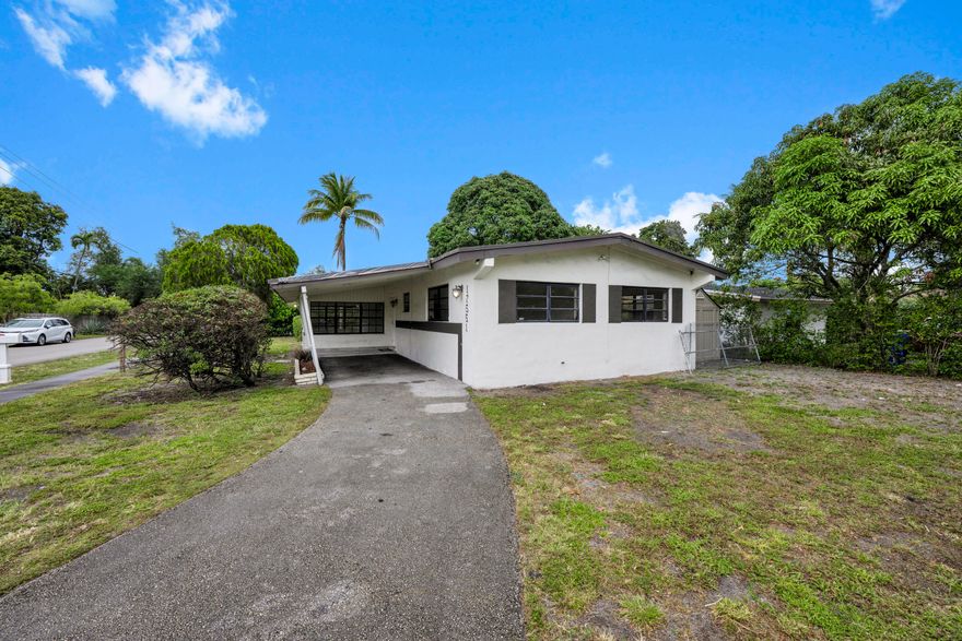Bright, renovated open concept gem in the heart of North Miami Beach — sit on an extended corner lot bathed in natural light with windows all around. Perfect for entertaining, the airy layout flows effortlessly from chef's kitchen to living and dining areas, spilling out to a serene patio for indoor outdoor living. Enjoy generous bedrooms, thoughtful upgrades, private laundry and storage — all within easy walking distance to places of worship. A joyful, move in ready sanctuary in a vibrant, welcoming neighborhood.