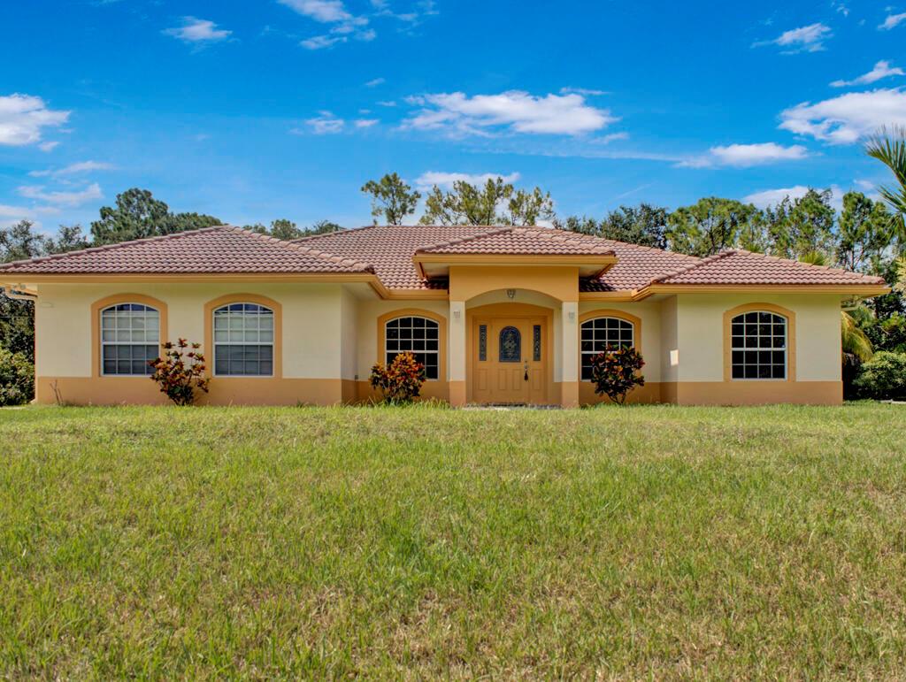 COME TAKE A LOOK AT THIS BEAUTIFUL 3 BEDROOM 2 BATH HOME LOCATED IN THE HEART OF LOXAHATCHEE. HOME OFFERS NEW WOOD LAMAINATE IN ALL BEDROOMS AND LIVING ROOM. LARGE MASTER BEDROOM WITH SPLIT FLOOR PLAN.LARGE LOT PERFECT TO ENJOY THE OUTDOORS IN. 2 CAR GARAGE ALONG WITH NO HOA RESTRICTIONS.