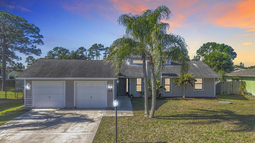 Photo of 718 SE Ablett Lane, Port Saint Lucie, FL 34984 (MLS # R11070730)