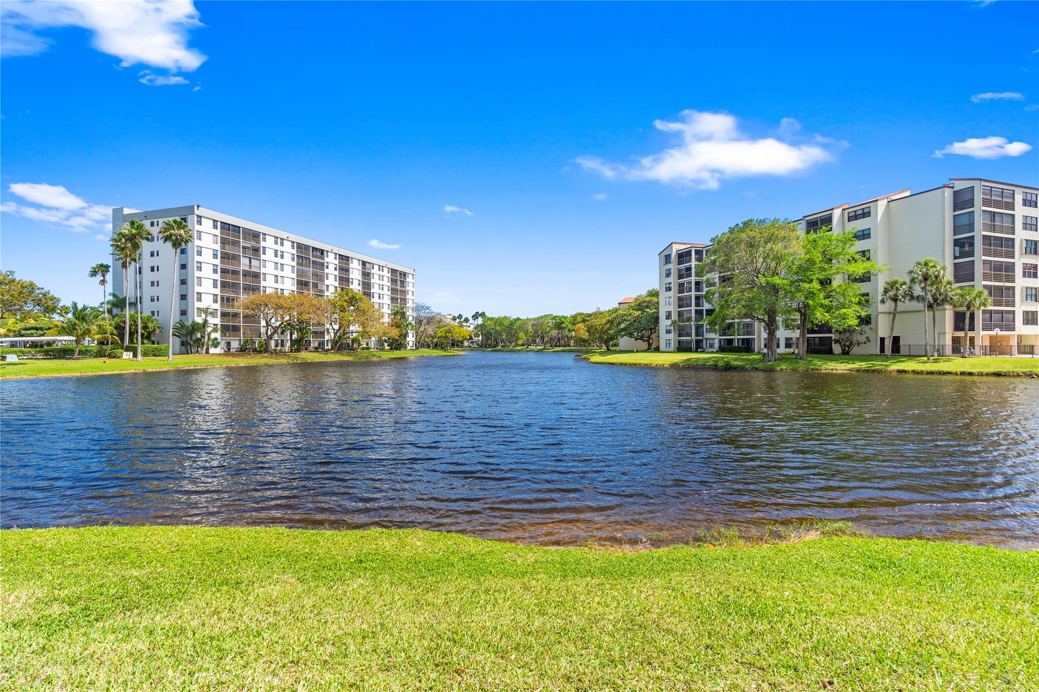 Welcome to this beautifully renovated 2/2 condo with model-style finishes throughout. Renovation was completed in 2024. Features include a 2020 AC, new water heater, quartz countertops, elegant wood cabinets with soft-close drawers, stainless steel appliances, and updated bathrooms. Brand new vinyl floors complete the stylish look. Enjoy stunning water views from this prime location. Seller pays assessment at closing, new roof 2024, Structural & milestone inspections completed, The community offers a large pool, clubhouse, fitness center, meeting/event room, and card room. Close to shopping, dining, entertainment, race tracks, and casinos. Parking is easy with a designated spot in front, plus additional storage inside the building. Move in ready! Don't miss out this incredible unit!