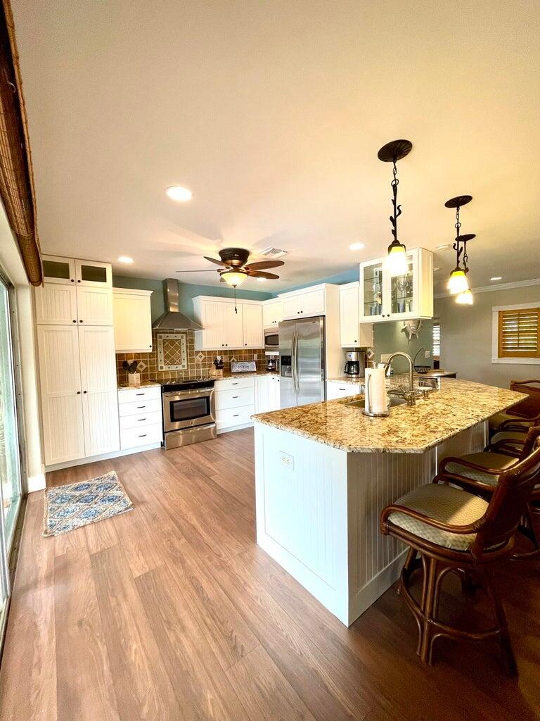 Photo of 724 Kittyhawk Way, North Palm Beach, FL 33408 (MLS # R11122285)