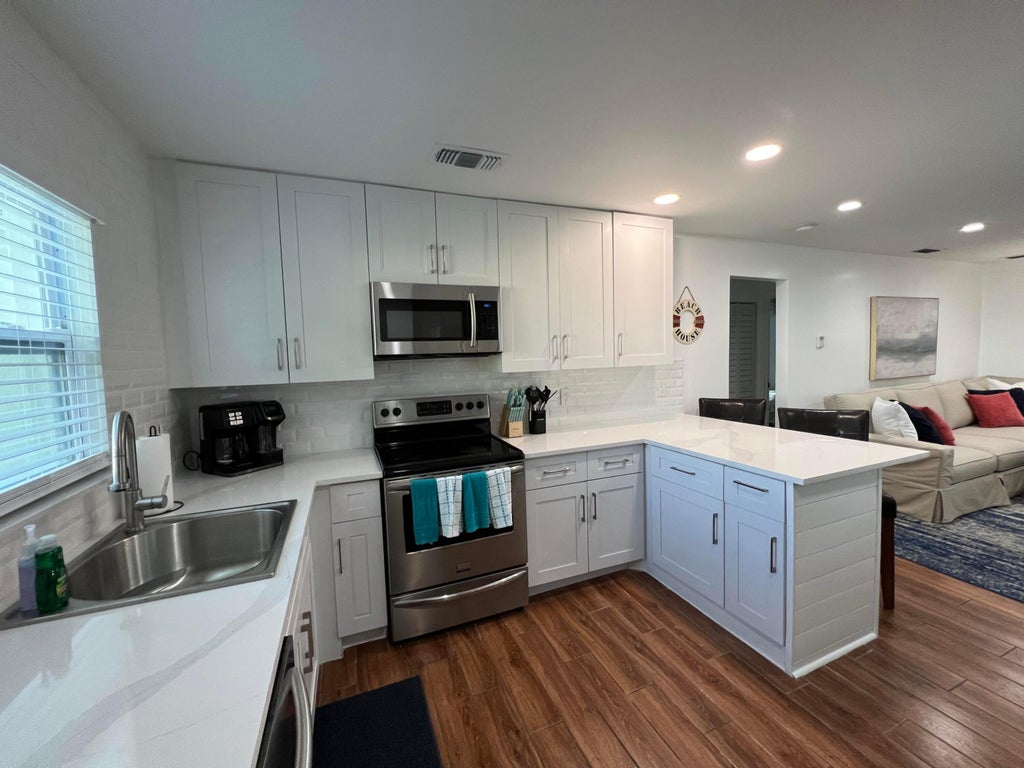 Photo of 4104 GARDEN Avenue, West Palm Beach, FL 33405 (MLS # B26078416)