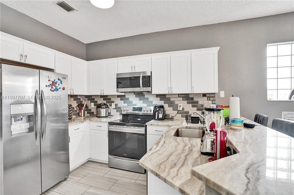 Photo of 4824 NW 19th Street, Coconut Creek, FL 33063 (MLS # B26011342)