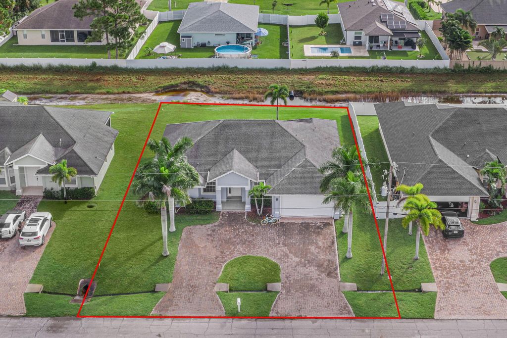 Photo of 2311 SW Halissee Street, Port Saint Lucie, FL 34953 (MLS # R11020325)