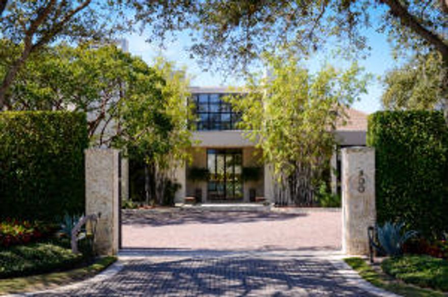 Iconic architect, Milton Klein, created this custom contemporary on 200' of PB's lakefront. At 21' above sea level, it boasts the most expansive water views in all of PB. Its many amenities include: deep water dock, infinity pool, 2 outdoor kitchens, home theatre, full spa, 5,000 bottle wine room, impact glass & full house generator. Turnkey & fully furnished.