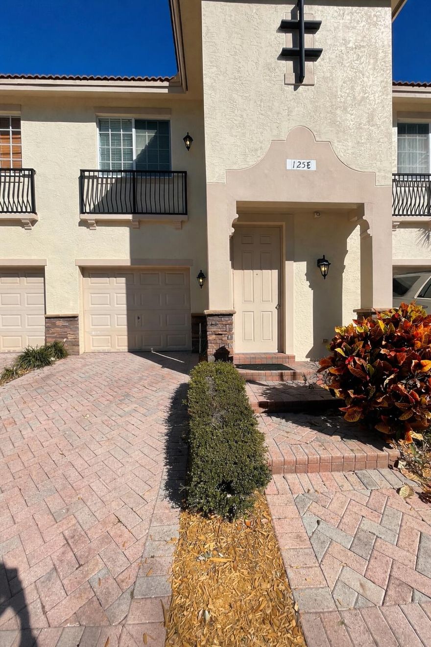 Bright and spacious 2-story townhome in prime East Delray, just minutes to Atlantic Ave and the beach. Features include 9' ceilings, crown molding, tumbled marble floors, and an open layout with a flex nook ideal for a bar or office. Kitchen offers granite countertops, stainless steel appliances, marble backsplash, and ample cabinetry. Upstairs bedrooms feature wood floors and walk-in closets. Primary suite includes dual sinks, soaking tub, and separate shower. Enjoy ocean breezes on your private patio. Impact windows, 2018 A/C, and 2021 water heater. Pet-friendly community with pool, playground, fitness center, and sidewalks, conveniently located near shopping, dining, and downtown Delray.