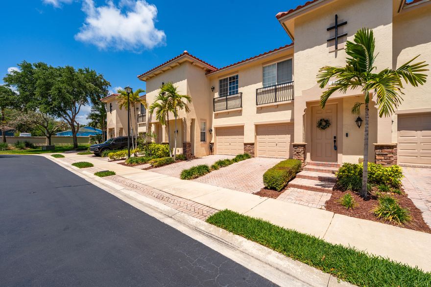 Bright and spacious 2-story townhome in prime East Delray, just minutes to Atlantic Ave and the beach. Features include 9' ceilings, crown molding, tumbled marble floors, and an open layout with a flex nook ideal for a bar or office. Kitchen offers granite countertops, stainless steel appliances, marble backsplash, and ample cabinetry. Upstairs bedrooms feature wood floors and walk-in closets. Primary suite includes dual sinks, soaking tub, and separate shower. Enjoy ocean breezes on your private patio. Impact windows, 2018 A/C, and 2021 water heater. Pet-friendly community with pool, playground, fitness center, and sidewalks, conveniently located near shopping, dining, and downtown Delray.