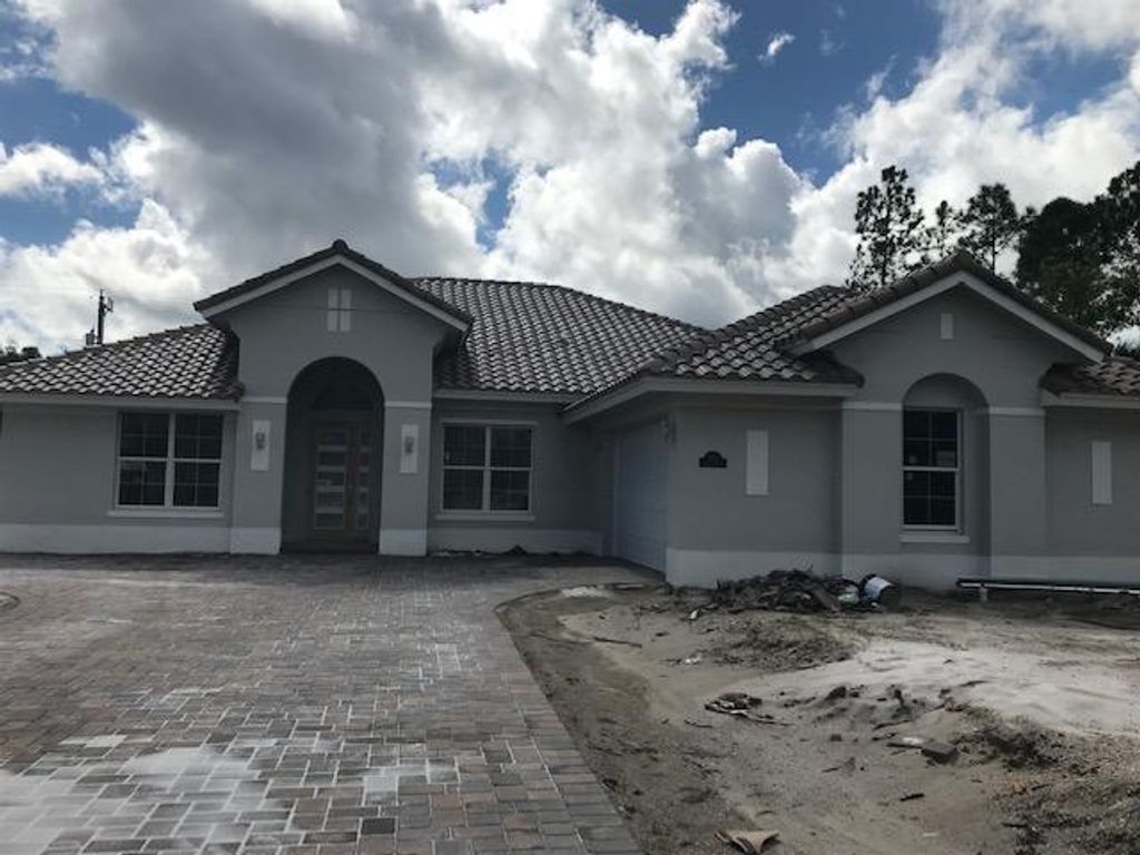 Photo of 2628 Conifer Drive, Fort Pierce, FL 34951 (MLS # R10666536)
