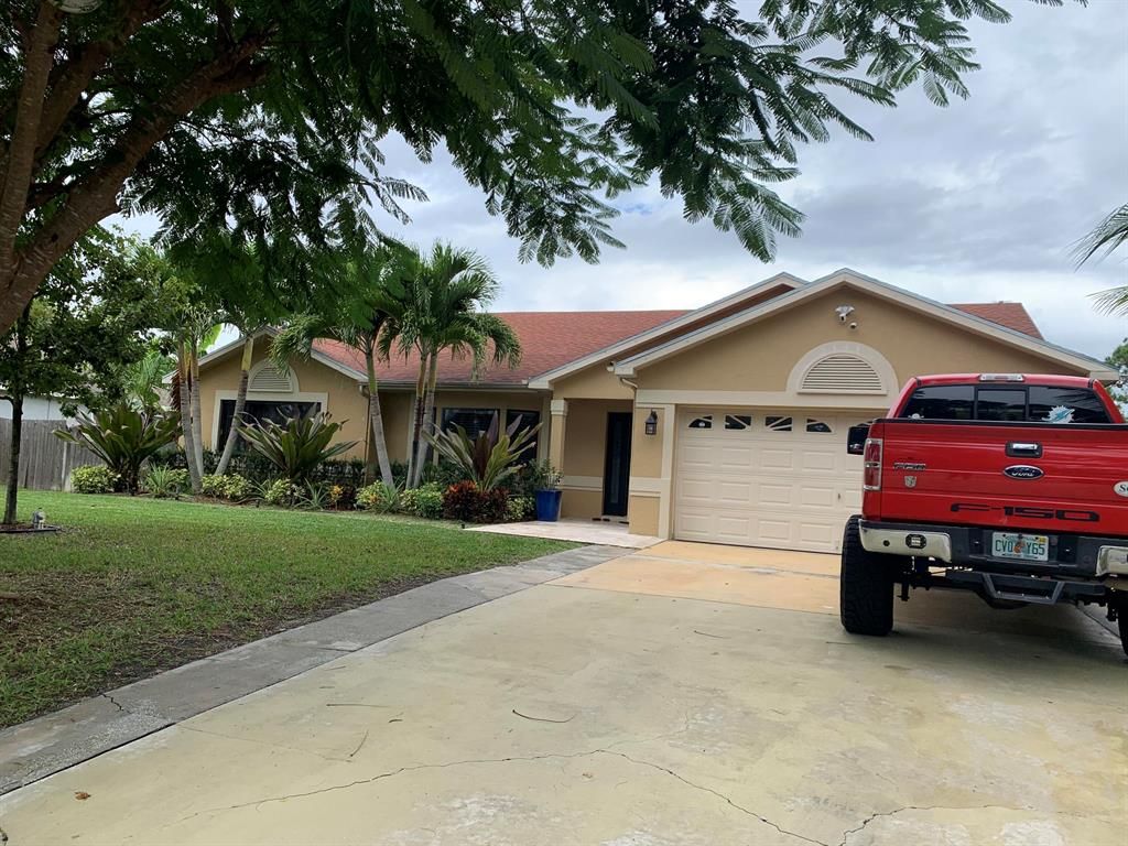 Photo of 1409 SW San Esteban Avenue SW, Port Saint Lucie, FL 34953 (MLS # R10760018)