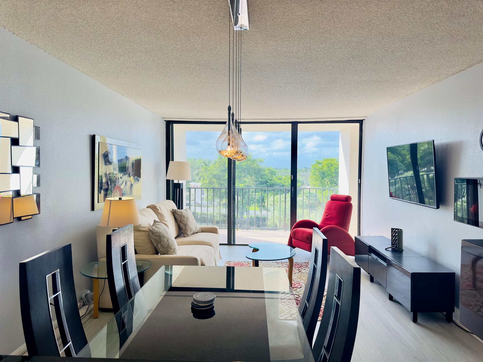 Welcome home to your renovated, turn-key, fully furnished condominium in Lakeshore Club. This charming 1/1 condo is INVESTOR FRIENDLY, allowing rentals immediately and 12x per year (1 per every 30 days).Perfect for year-round living or enjoy Palm Beach for the season. Gorgeous sunsets from your private balcony with access form the bedroom and living room. Ample natural lighting, brand new vinyl flooring throughout, granite countertops, updated bathroom with glass door, and custom barn doors in the bedroom. Soak up the sun in the gorgeous heated, saltwater pool overlooking Lake Mangonia, Fitness Center, Clubhouse with meeting area/kitchen, and common laundry on each floor. Outdoor BBQ entertaining area is surrounded by lush tropical landscaping. Building is complete with