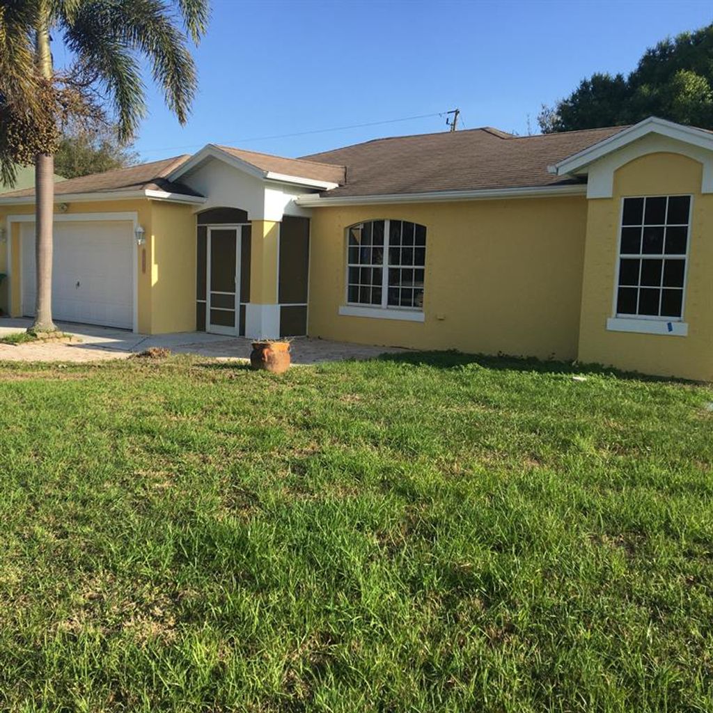Photo of 1692 SW Escobar Lane, Port Saint Lucie, FL 34953 (MLS # R10703208)