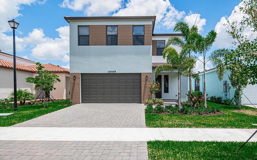 Welcome to 16469 Sea Turtle Place, the newest waterfront smart home built in 2024 in gated community Sky Cove. LOW HOA $164.90/mo. Impact windows and sliding glass doors, tankless water heater, Energy Star appliances, ample frameless cabinetry, soft-close drawers, pantry, large quartz island with double sinks and a breakfast bar.  An open floor plan with LED recessed lighting, smart home wiring, and a spacious living and dining area overlooking the beautiful lake. With a 5,249sf Premium lakefront lot, there's plenty of room for a pool, fence, and to extend the covered patio. High 8 ft interior doors. Security dashboard with a 5'' touchscreen for automation options. Antibacterial UV light on AC. 2-car garage plus additional driveway parking. No rear neighbors.