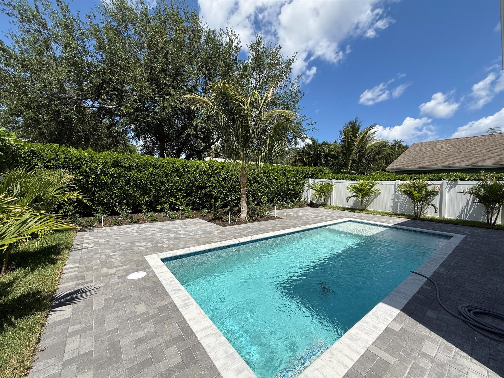 Don't let the insurance chaos keep you from buying! This SUPERIOR BUILT ALL CONCRETE BLOCK homes insurance is only $2,600/yr!! Total renovation & the brand new pool just completed. BRAND NEW: LVP floor, LED recessed lighting, custom kitchen w/ quartz waterfall island & premium appliances, bathrooms w/ porcelain tile & designer details, exterior stone accents, premium quartz tops, custom aluminum stair railing, W&D, WH, fence, driveway pavers, gutters+ lots more. The primary suite is large w/ a tray ceiling, designer wall trim, custom WIC & large shower. Bedrooms 2 & 3 are large, perfect for a home office or gym. Relax in the pool w/ sun shelf & deck jet water features surrounded by lush landscaping & huge paver deck, all impact glass, AC 12/22, 15' side yard.
