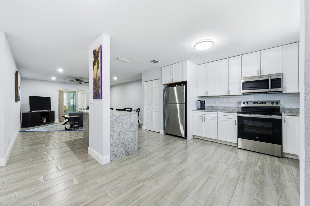 Photo of 586 Laconia Circle, Lake Worth, FL 33467 (MLS # B26016109)