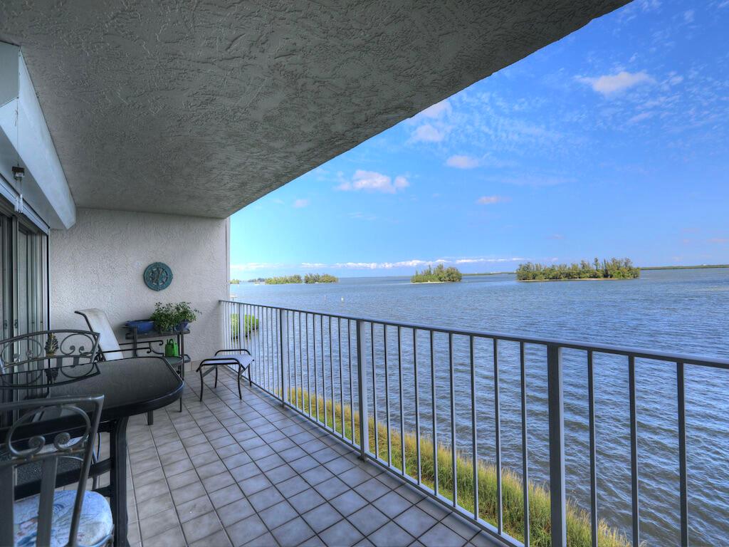 Direct Riverfront Condo w/ Expansive Panoramic Unobstructed Views, Enjoy Dolphins, Manatees, fish & much morefrom your 27 feet of covered balcony. Upgraded Kitchen, Fresh Paint & Meticulously maintained. River Run Community Features Clubhouse, heated pool, tennis & gym. Close to beach, shopping & dining. 1 Car Garage included with door opener. Sizes are approx/subj to error.