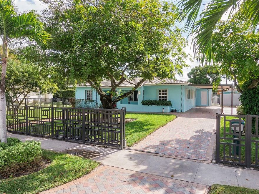 Wow! A stunning home in Miami Gardens (Norwood area) available for you! The custom electronic gate & fencing outline this manicured property & beautiful pavers accent the many walkways, patio areas & large driveway/carport. This 4 Bedroom 2 Full bath ranch home has a split bedroom plan. Love the Stunning NEW updated kitchen with white shaker cabinets, quartz countertops & stainless steel appliances. Spacious & private fully fenced backyard has a covered patio, mango tree, storage shed & room enough to add a pool. Perfect Airbnb, investment opportunity or your 1st home. Great location: 1.5 miles from the Hard Rock Stadium and 1 mile from Top Golf and 5.5 miles from the beach. 6.5 miles to the beautiful Hard Rock Guitar Hotel and Casino. Convenient commuting to the Turnpike & I95.