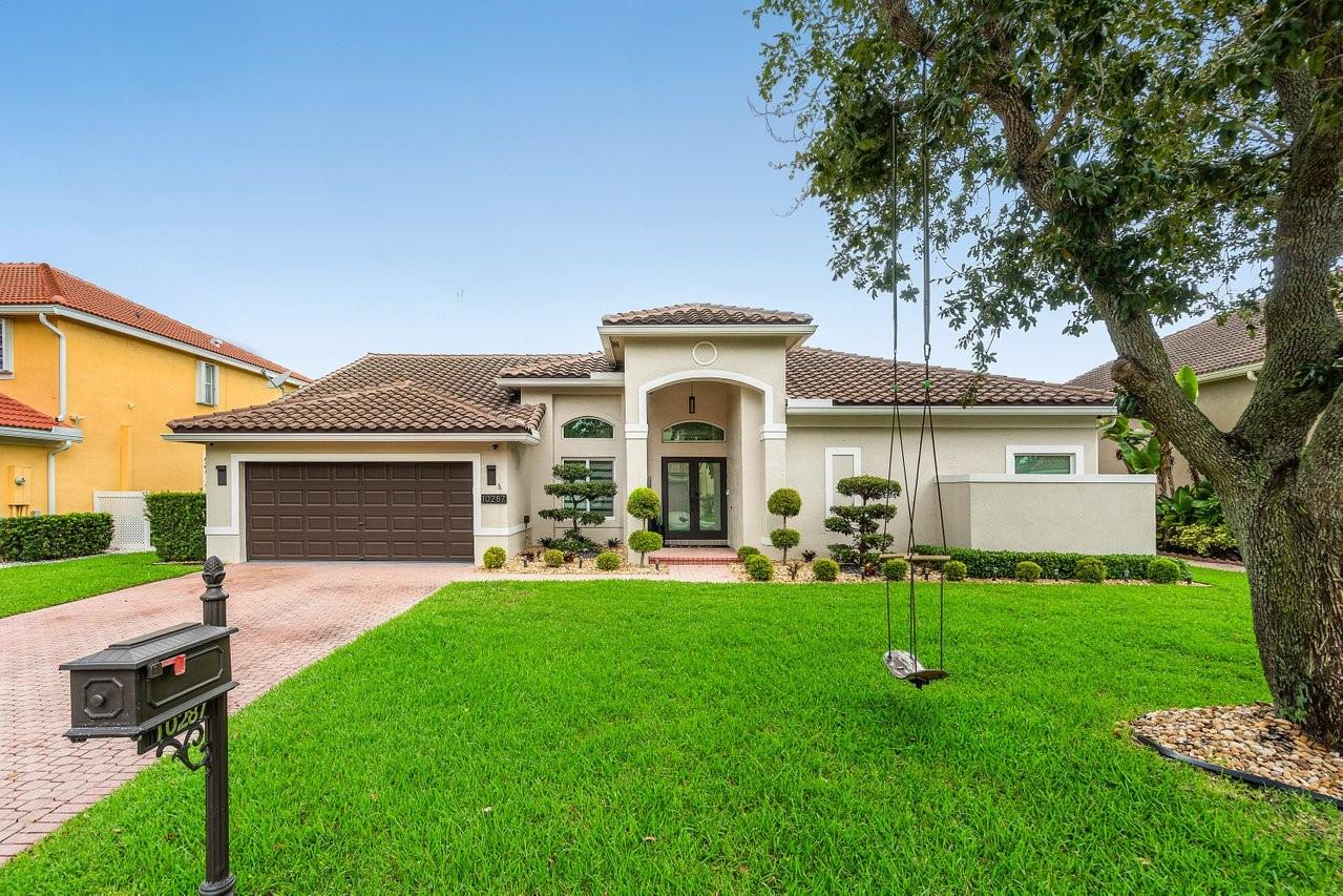 Discover luxury living in this turn key 4 bed/3 bath home in the prestigious Yardley Estates, zoned for A rated schools. Over 200K in renovations, This residence features elegant porcelain tile flooring throughout, vaulted ceilings, and custom window treatments. The fully remodeled kitchen offers brand new cabinetry, a sleek quartz island, countertops, and premium stainless steel appliances. Full impact windows and doors, a new roof (2020), two-stage AC (2024), water heater (2024), remodeled master bathroom, custom walk-in closet (2024), brand new electrical panel (2025), and an advanced CAT5 security camera system (2025). The two car garage offers upgraded epoxy flooring and ample storage. Located on a quiet, family friendly street, this beautiful residence is a move in ready masterpiece.