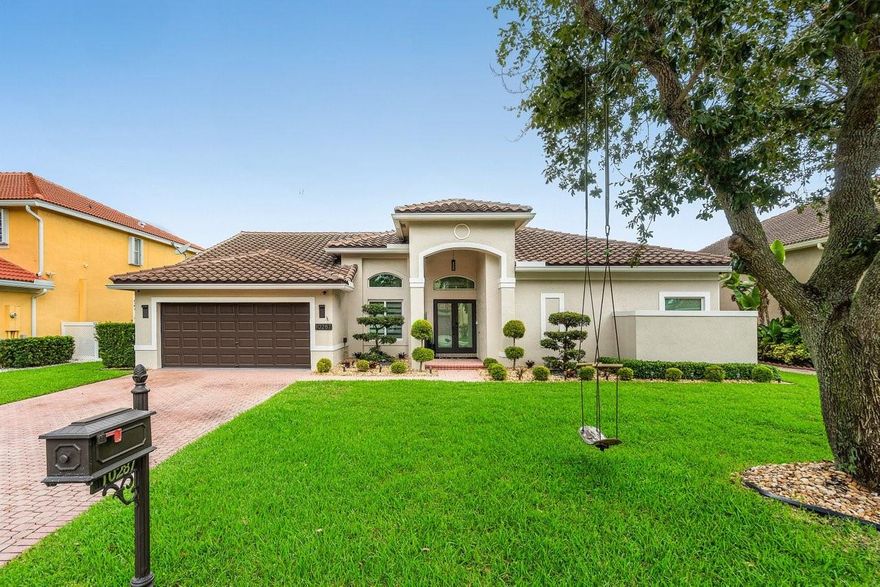 Discover luxury living in this turn key 4 bed/3 bath home in the prestigious Yardley Estates, zoned for A rated schools. Over 200K in renovations, this residence features an open floor plan with elegant porcelain tile flooring throughout, vaulted ceilings, and custom window treatments. The fully remodeled kitchen offers brand new cabinetry, a sleek quartz island, countertops, and premium stainless steel appliances. Full impact windows and doors, a new roof (2020), two-stage AC (2024), water heater (2024), remodeled master bathroom, custom walk-in closet (2024), and an advanced CAT5 security camera system (2025). Located on a quiet street, this beautiful residence is a move in ready masterpiece.