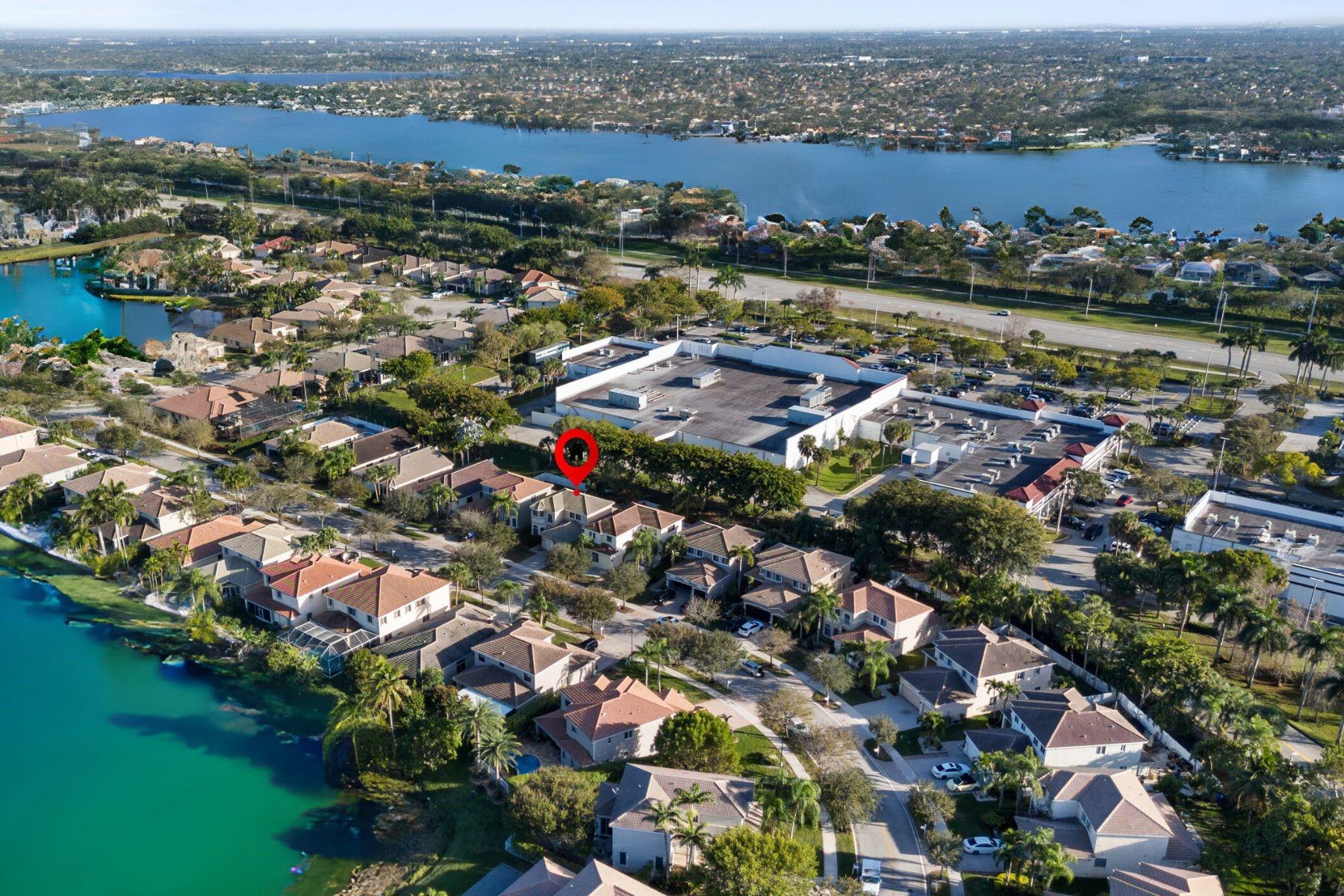 SELLER IS OFFERING CREDIT FOR A 2-1 BUY DOWN! Live in the gated Laguna Isles with resort amenities: pool, spa, tennis, fitness center & lakefront paths. Interior upgrades include floor-to-ceiling MARBLE baths, a grand MARBLE staircase with marble upstairs flooring, & a first-floor primary suite with custom closets, freestanding spa tub, marble shower & Bluetooth lighting with surround sound. The spacious kitchen offers NATURAL GAS cooking, granite counters & seamless flow to the living & outdoor areas. Step outside to a freshly paved patio, vinyl fencing, oversized planters & mature mango trees. Bonus features: 2020 HVAC, impact frosted-glass front door, recessed lighting, oversized windows, new marble bathrooms, high-quality finishes, + HOA covering lawn care & irrigation. MOVE-IN READY!