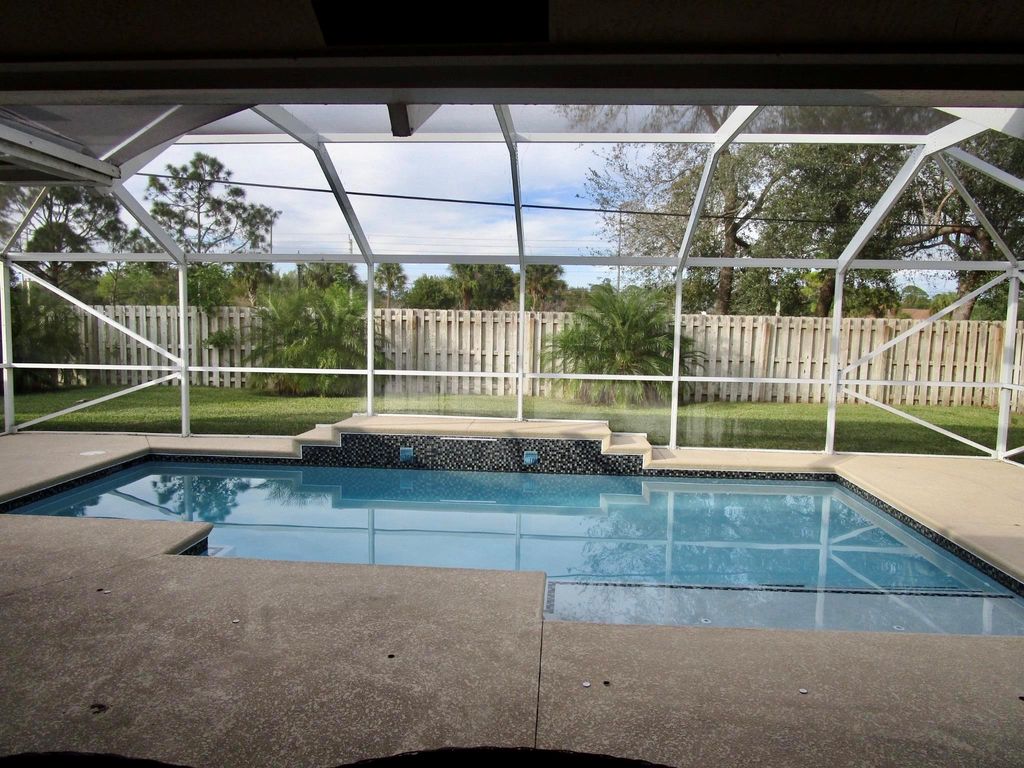 Photo of 1619 SW Escobar Lane, Port Saint Lucie, FL 34953 (MLS # R10969761)