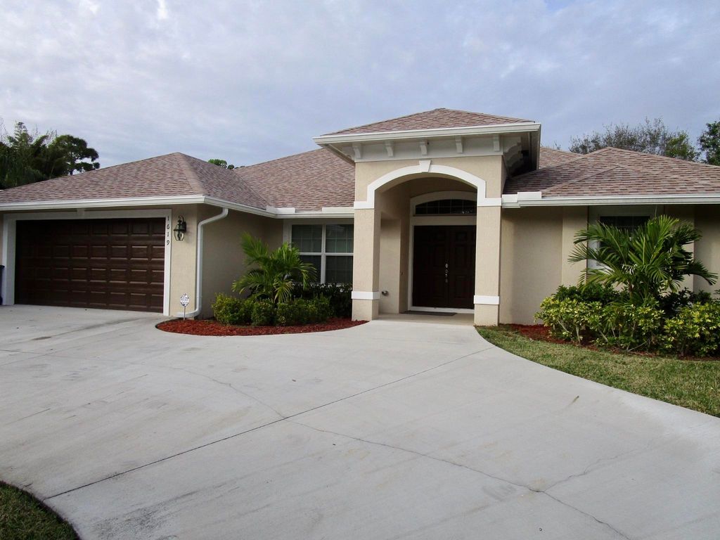 Photo of 1619 SW Escobar Lane, Port Saint Lucie, FL 34953 (MLS # R10969761)