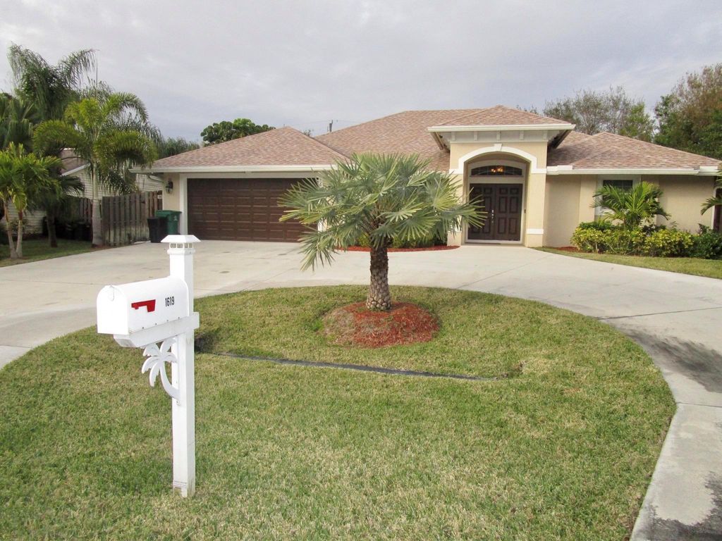 Photo of 1619 SW Escobar Lane, Port Saint Lucie, FL 34953 (MLS # R10969761)