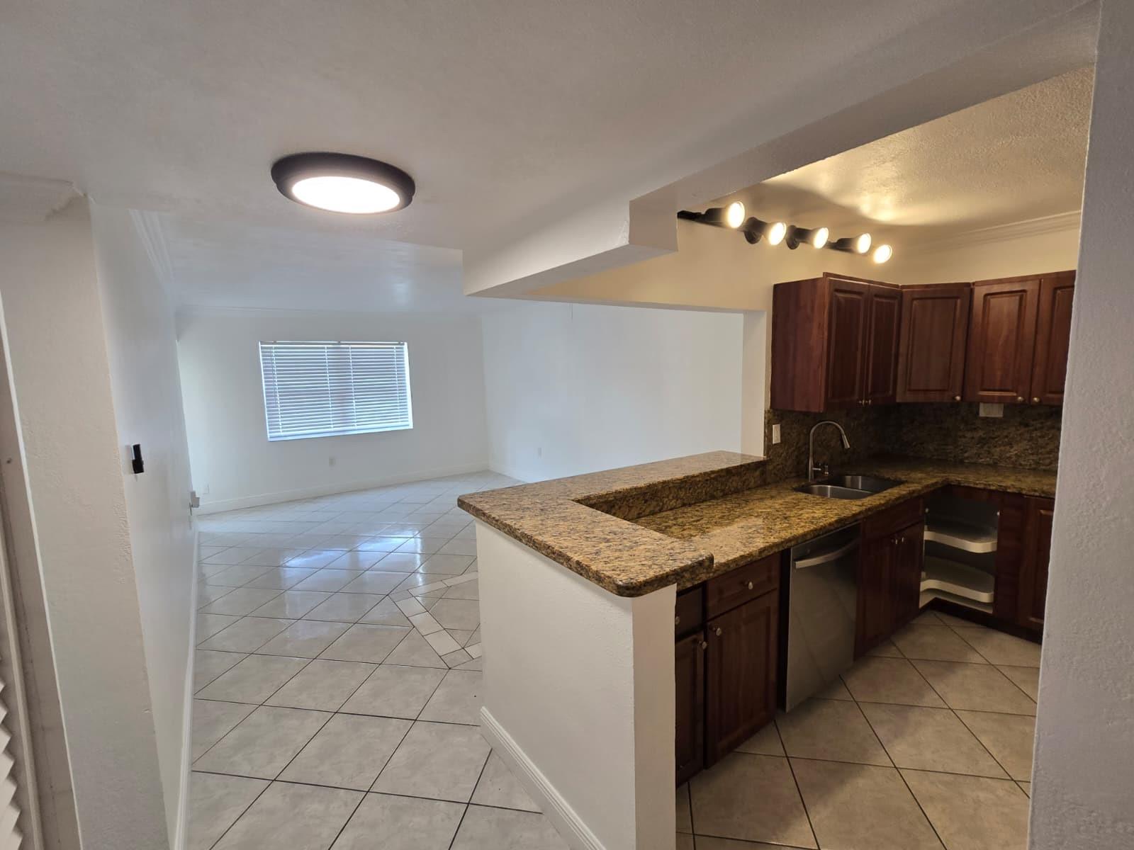 Don't miss this opportunute to rent this spacious 2/2 apt on the 1st floor. EASY TO APPROVAL. Kitchen open concept with new appliances, Master bedroom with walk-in closet, granite counters, new paint walls and celing, crown moldings, ceiling fans, screened in balcony, fitness facility, pool, great location, close I95 and Turnpike Highways, close to Seabra, Publix and Walmart supermakts.