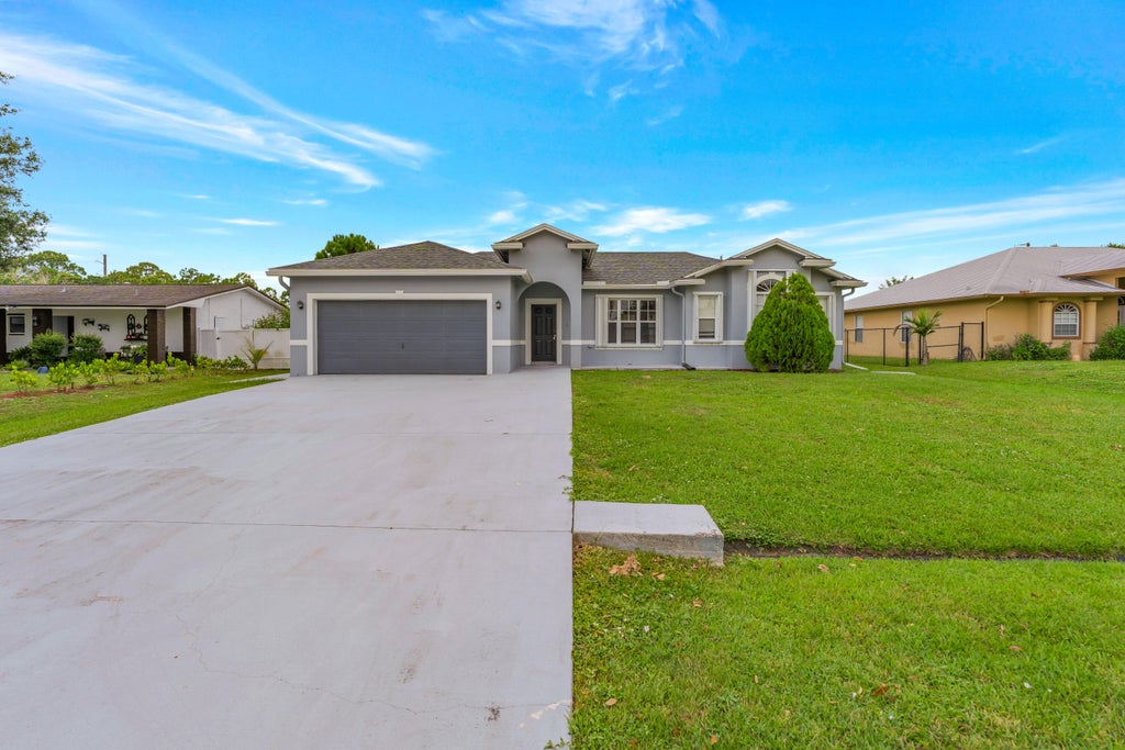 Photo of 2320 SW MADRID Road, Port Saint Lucie, FL 34953 (MLS # B26059417)