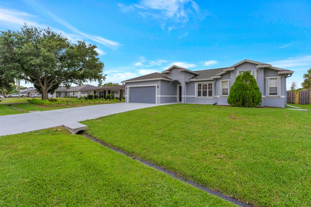 Photo of 2320 SW MADRID Road, Port Saint Lucie, FL 34953 (MLS # B26059417)