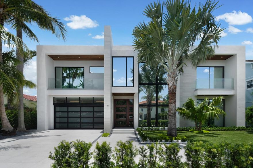 Experience cutting-edge design and comfort at 141 Cortez Rd. in W.P.B.'s prestigious SoSo area, near the Intracoastal. This 6,774 sq. ft. home epitomizes modern luxury, offering sophistication and ease. Highlights include a grand entry foyer with a magnificent staircase, a state-of-the-art media room, and a chef's kitchen with high-end appliances and wood-accented ceilings. The stylish dining area provides pool views. The living room features a fireplace and wet bar, perfect for entertaining. The attached guest house includes a kitchenette and private balcony. The owner's suite boasts dual baths and a balcony overlooking the pool. Enjoy the rooftop deck with stunning views. Additional features include a luxurious elevator, Control4 automation, laundry on both floors, and a 60 kW generator Welcome to 141 Cortez Rd., where cutting-edge design meets unparalleled comfort in the heart of West Palm Beach's prestigious SoSo area, just four homes away from the Intracoastal. This extraordinary home boasts 6,774 sq. ft. of air-conditioned space and is a testament to modern luxury, offering a lifestyle of sophistication and ease.

As you approach, the sleek lines and contemporary architecture set the tone for what lies within. The grand two-story entry foyer and the sophisticated modern staircase to the right are truly magnificent. Inside, every detail has been thoughtfully designed for contemporary living, with the finest LED cove lighting and accent lights from Environmental Lights enhancing the ambiance throughout the home.

The state-of-the-art media room is wired for an immersive cinematic experience, while the spacious first-floor office offers a tranquil workspace bathed in natural light. The chef's kitchen is a modern culinary haven, boasting wood-accented ceilings, high-end appliances, and an inviting eat-in island perfect for casual gatherings.

The separate dining area, accented with a decorative wood ceiling and complemented by floor-to-ceiling glass views of the pool, adds a touch of elegance to every meal, while the living room's fireplace and wet bar make it the ultimate space for entertaining.

The attached guest house is a modern marvel, featuring its own kitchenette and private balcony. Overlooking a stunning 36 ft. pool with a 10 ft. sun shelf and spa, this space ensures your guests enjoy luxury on par with the main residence. The poolside area also includes a fully equipped outdoor kitchen, perfect for al fresco dining and entertaining.

The owner's suite redefines opulence with its dual side-by-side master baths and grand balcony overlooking the pool, creating a serene retreat for relaxation. All three guest bedrooms feature deluxe ensuite bathrooms, offering privacy for family members and guests.

Imagine sipping your morning coffee on the tiled roof deck, where glass railings offer uninterrupted views of the tranquil waters. The deck is perfect for entertaining, equipped with gas and water hookups for future use like a summer kitchen.

Technological innovation and convenience are at the forefront of this home's design. The home features a luxurious elevator and laundry facilities on both the first and second floors. It is also equipped with Control4 automation and lighting and is wired for Lutron Sivoia QS shades, making every aspect of this residence controllable with ease. There is also a wired security system and high definition cameras as well as built-in speakers that play streaming media throughout the home and loggia. A whole home 60kW Kohler generator ensures that comfort and convenience are never compromised.

141 Cortez Rd. is more than just a home; it's a sanctuary of modern luxury. Whether you're lounging by the pool, enjoying a film in the media room, or simply relaxing in your master suite, this residence offers a perfect blend of cutting-edge technology and refined elegance. Welcome to the future of living in one of West Palm Beach's most sought-after neighborhoods.