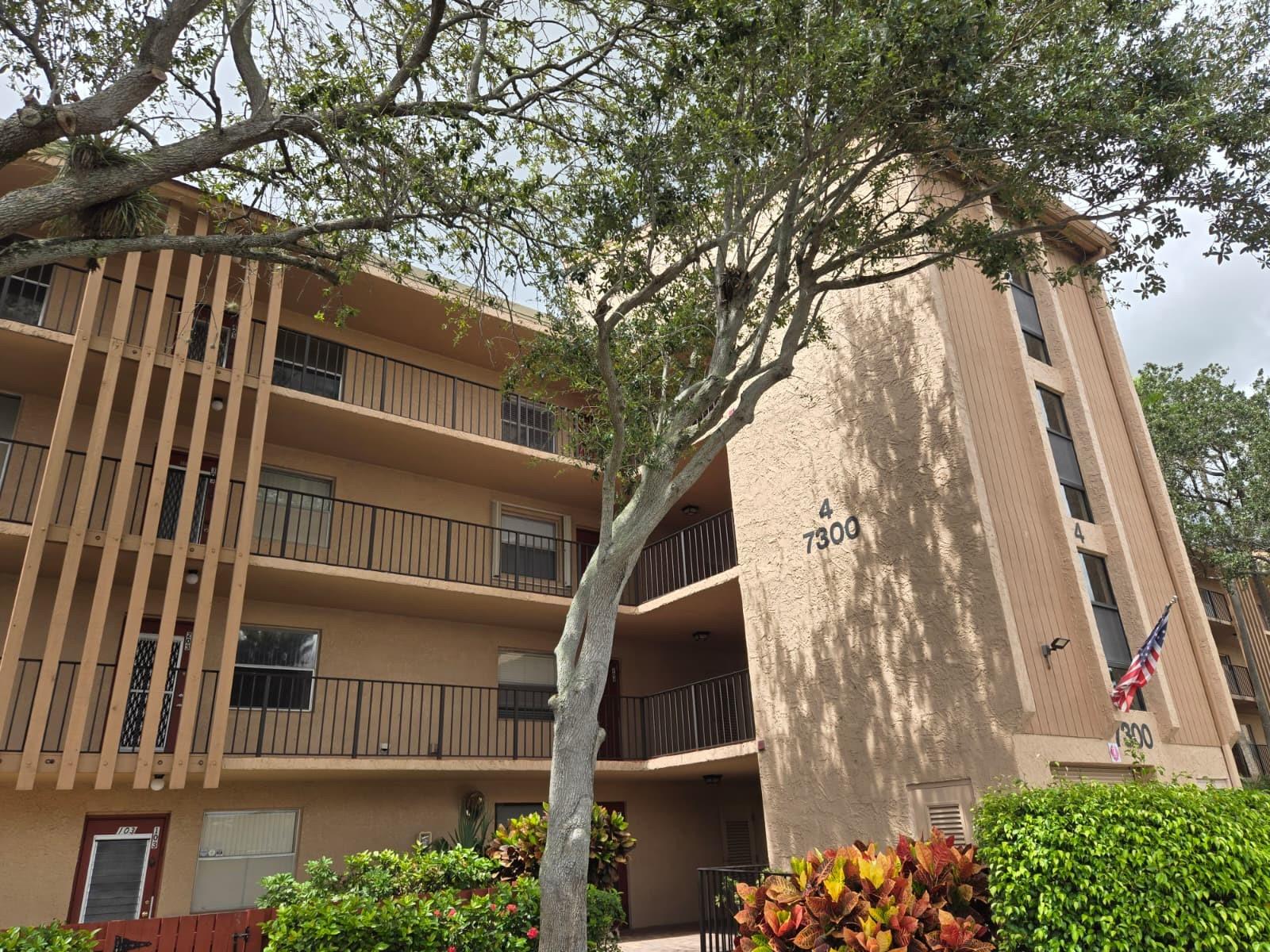 Retire in style in this TOP FLOOR, light and bright CORNER unit with PORCELAIN tile throughout, updated bathrooms, and large balcony overlooking garden with trees for privacy and lake in the distance. Use your own WASHER/DRYER IN your condo! Right next to the clubhouse with large party room, beautiful pool, spa and workout equipment. Remodeled Publix right next door in walking distance! Pompano Beach is a straight shot across Atlantic Blvd. to the east about 10 miles. Coral Square Mall is a short drive away. Association allows two small pets! 1 assigned parking spot with PLENTY of guest parking. Friendly community with clubs and activities.