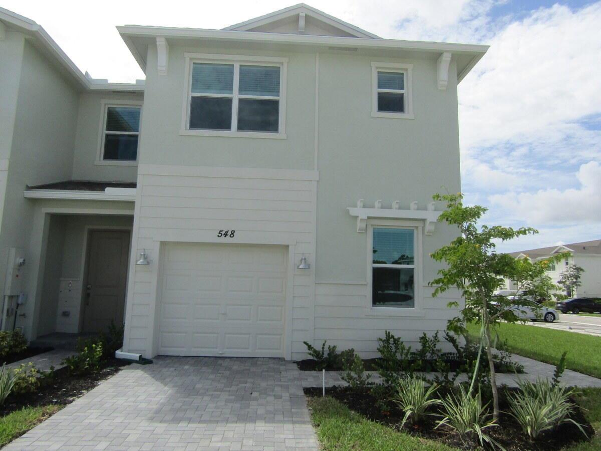 Brand new townhome, just built, 3/2 & 1/2 bath with a office space on the 1st floor.Impact Windows .This two-story townhome showcases a contemporary open design among the first-floor kitchen, dining room and living room to promote seamless transitions between spaces. Through sliding glass doors is a terrace for outdoor relaxation. Upstairs caters to all three bedrooms, including the spacious owner's suite complemented by an adjoining bathroom and oversized walk-in closet. Prices, dimensions and features may vary and are subject to change.